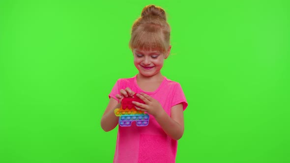 Child Girl Playing Squishy Silicone Bubbles Sensory Toy Simple Dimple Pop It Game Green Chroma Key