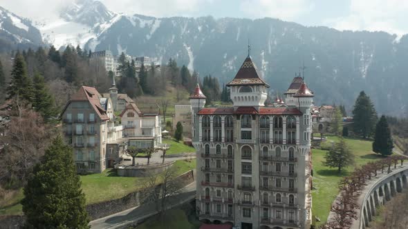 Aerial orbit of beautiful Swiss Hotel Management School in the hills of Switzerland. The SHMS is loc