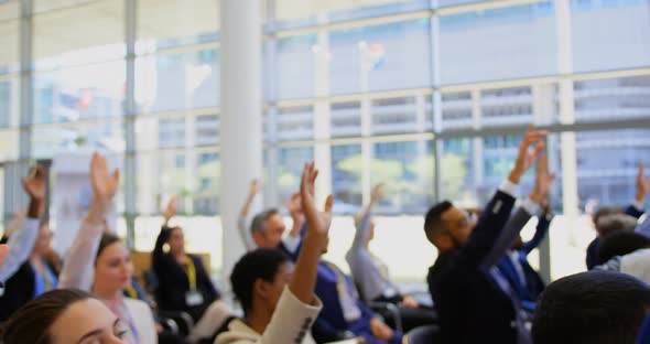 Multi ethnic business people raising hands in the business seminar 4k