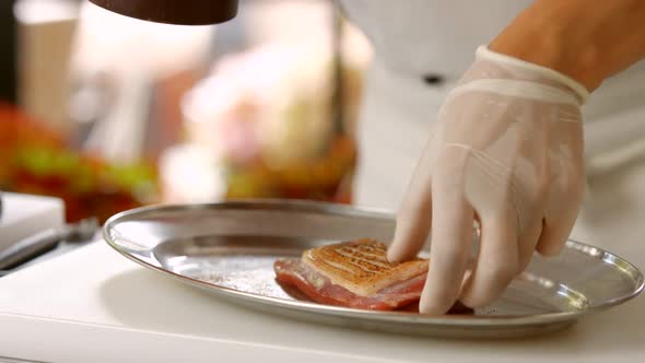 Pepper Dispenser Over Raw Meat.