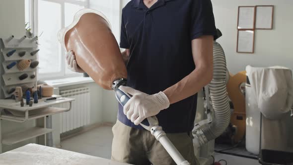 Craftsman Demonstrating Artificial Leg