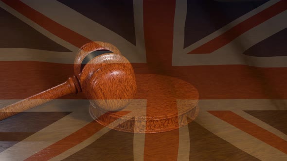 English judiciary. Flag of the United Kingdom and Judge's gavel.