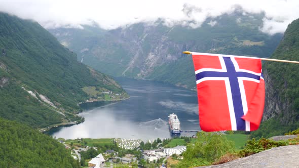 Norwegian Flag And Geirangerfjord With Cruise Ship