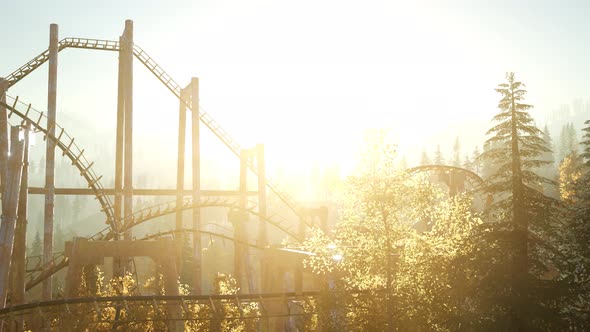 Old Roller Coaster at Sunset in Forest