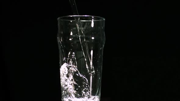 Water filling a pint glass