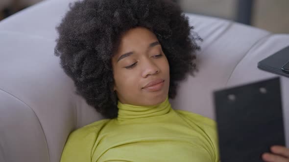 Closeup of Tired Young African American Woman Falling Asleep Working Distantly in Home Office