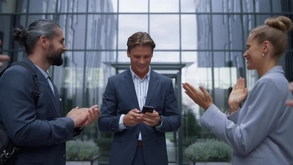 Businessman Announce Happy News to Employees