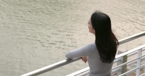 Woman enjoy the view at lakeside