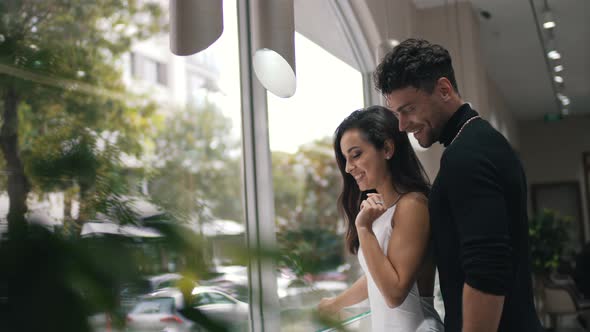 Woman and Man Choosing Jewelry in the Store