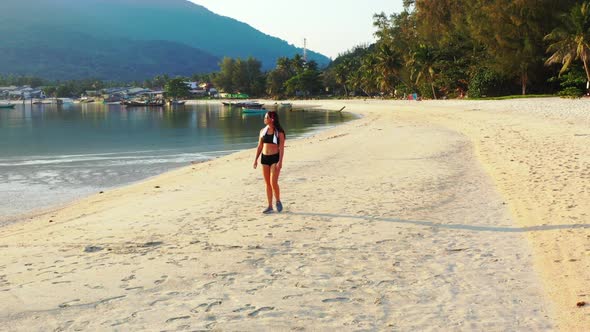 Beautiful ladies look beautiful on paradise island beach time by blue sea with white sand background