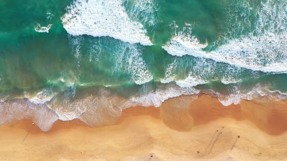 Aerial Top View Waves Crashing Along The Beach