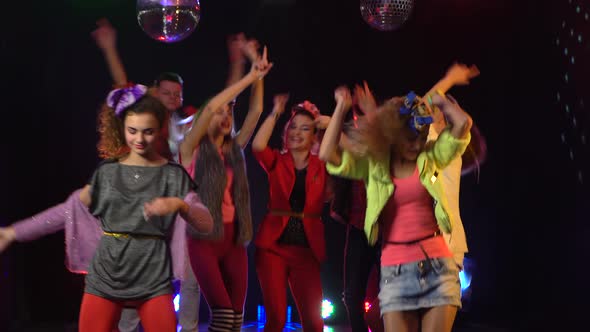 Crowd of Fans Dancing Jumping Dancing in Studio . Smoke Background