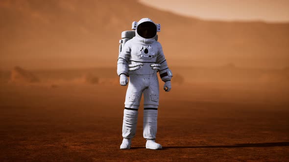Astronaut on Mars Surface. Red Planet Covered in Gas and Rock