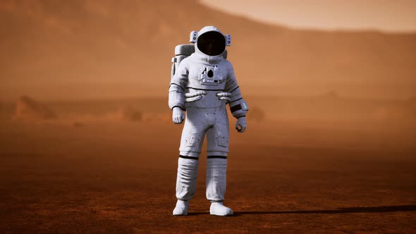 Astronaut on Mars Surface. Red Planet Covered in Gas and Rock alt