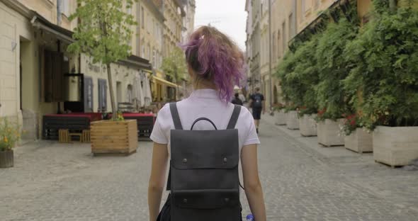 Beautiful Student Teenager Girl with Backpack Walking, Back View