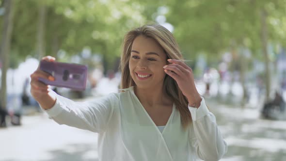 Happy Young Woman Taking Selfie Outdoor