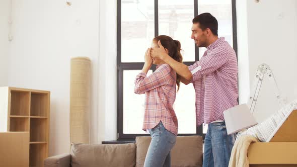 Happy Couple Moving To New Home and Hugging