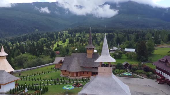 Aerial View Pan Left With Borsa Pietroasa Monastery In Romania