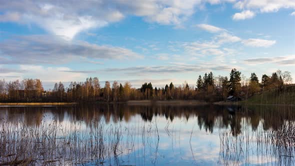 A lake near village in a forest