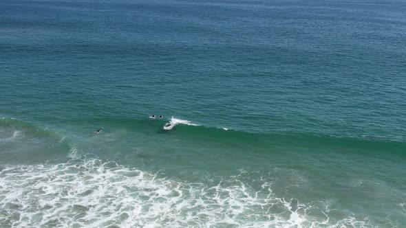 Surfer Catches A Wave