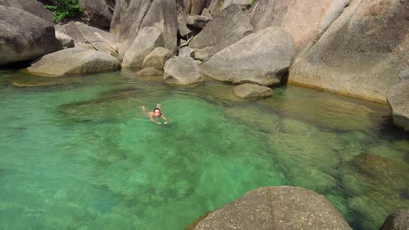 Woman Enjoys Her Vacation on Tropical Island, She Swims at Clear Ocean Water
