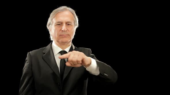 Middle Age Elegant Businessman Gesturing Isolated on Black