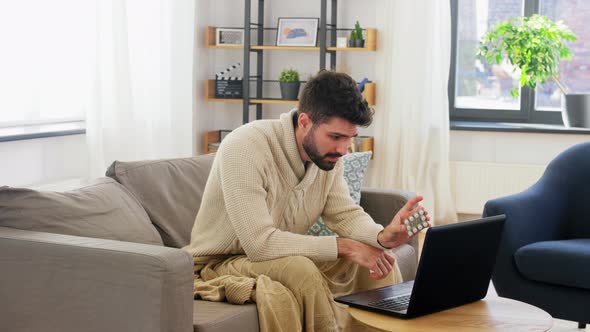 Sick Man with Medicine Having Video Call on Laptop