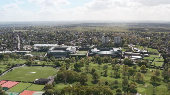 Slow drone shot towards Wimbledon Centre court and court 1 stadium