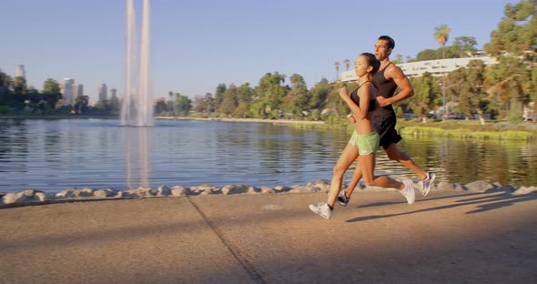 Athlete Couple Jogging In The Park