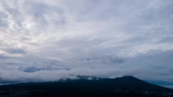 Rotating Time Lapse city, volcano, sky and hills