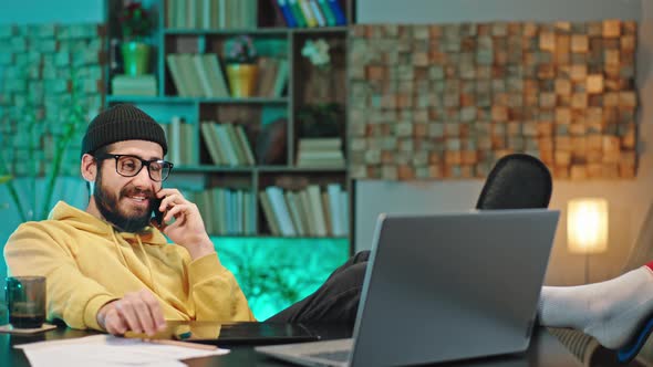 Attractive Man in His Home Office Relaxed Laying