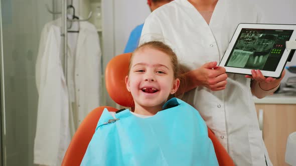 Close Up of Happy Girl Patient Looking at Camera Laughing