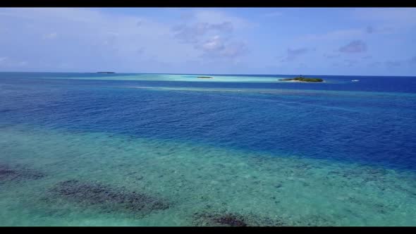 Aerial drone view panorama of marine coast beach adventure by shallow ocean and white sandy backgrou