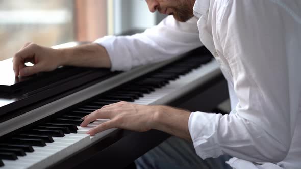 The composer-pianist improvises, composes music and plays the piano.