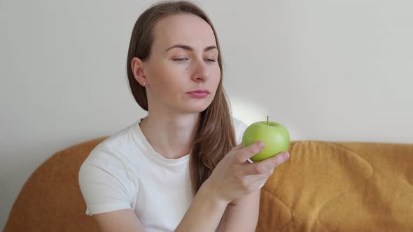 Woman Holding a Green Apple in Her Hands Healthy Diet Concept