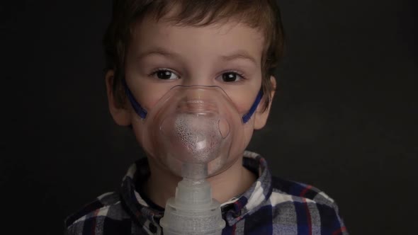 Footage Young Boy Inhaling Through Inhaler Mask