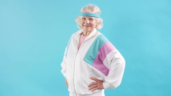 Happy Old Woman Raising One Hand, Showing Strength of Her Musculs, Sport Achievement.