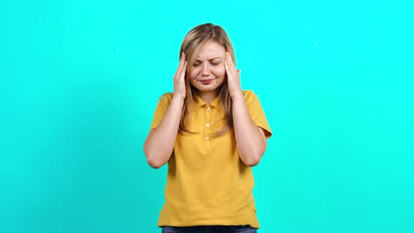 The Modest Young Woman Feels Bad, Puts Her Hand on Her Nose