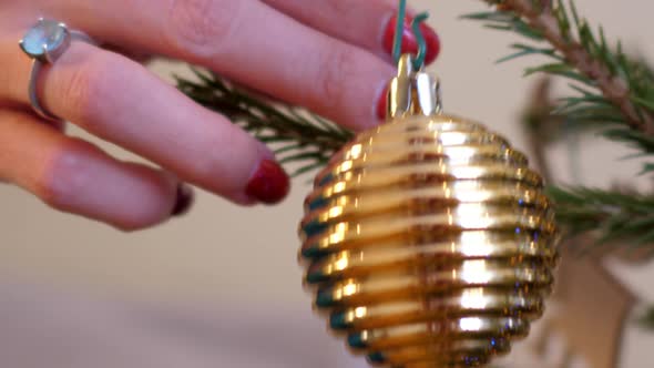 Close Motion From Ball To Snowflake Hung on Christmas Tree