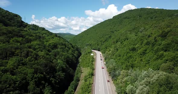 Aerial View of a Rural Highway Between Mountains