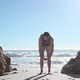 Young man doing yoga on beach - VideoHive Item for Sale