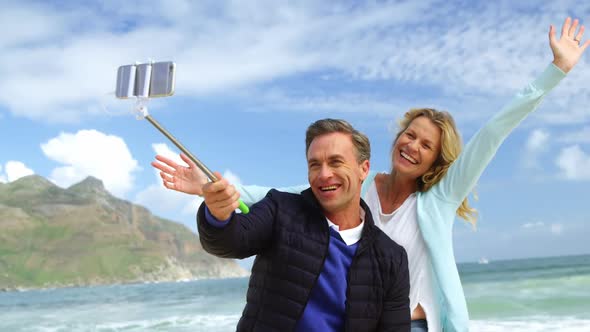 Mature couple taking a selfie from selfie stick