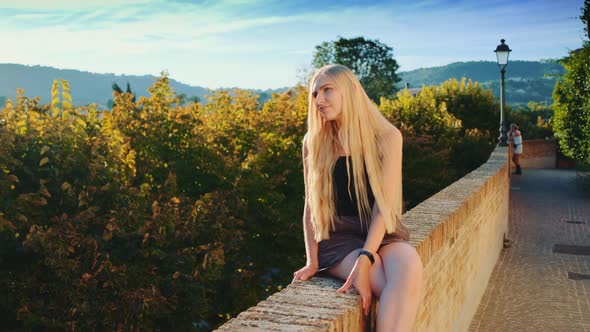 Woman Enjoying the Sun Rays in Summer