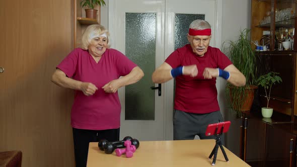 Mature Couple Man and Woman Fitness Trainer Coach Records Video Online Workout Exercises Course