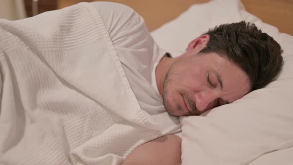 Middle Aged Man Sleeping in Bed Peacefully