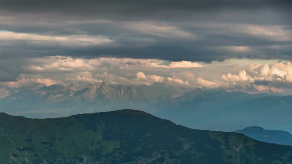 Gray Clouds Moving over Alpine Mountains in Summer evening Landscape