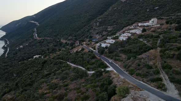 Car Travel Concept Aerial View of Mountain Road Near Sea at Lefkada Island