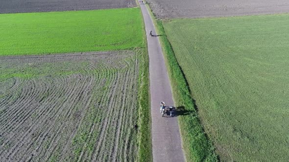 Aerial footage of bikeriders in countryside.