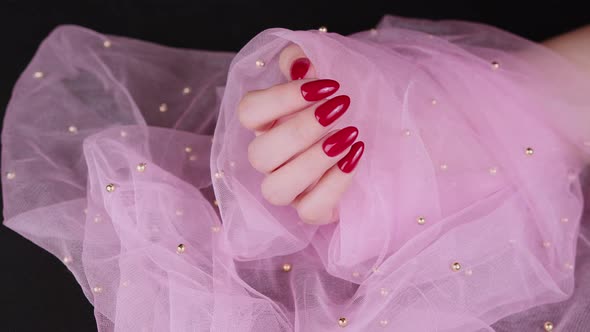 Woman's Hand with Red Nails