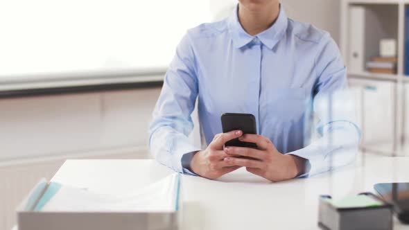 Businesswoman with Smartphone Working at Office 24